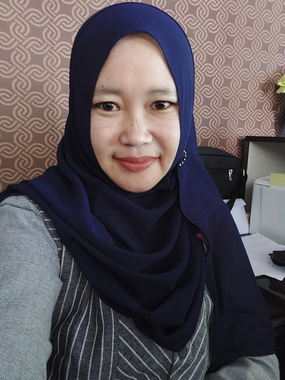 Hasni Hartati